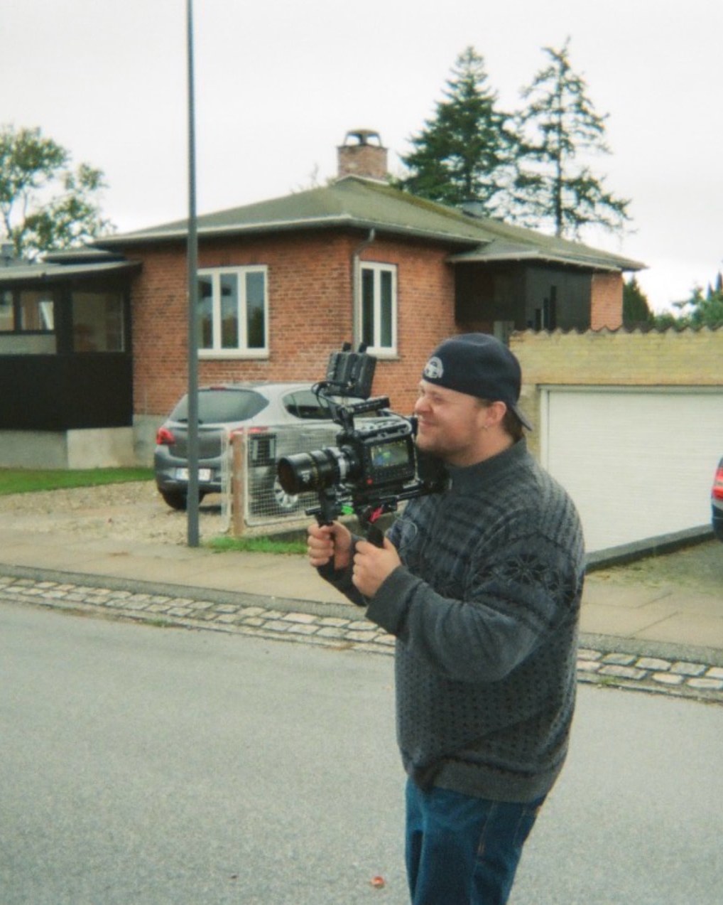 Bastian Hermansen on set with a camera